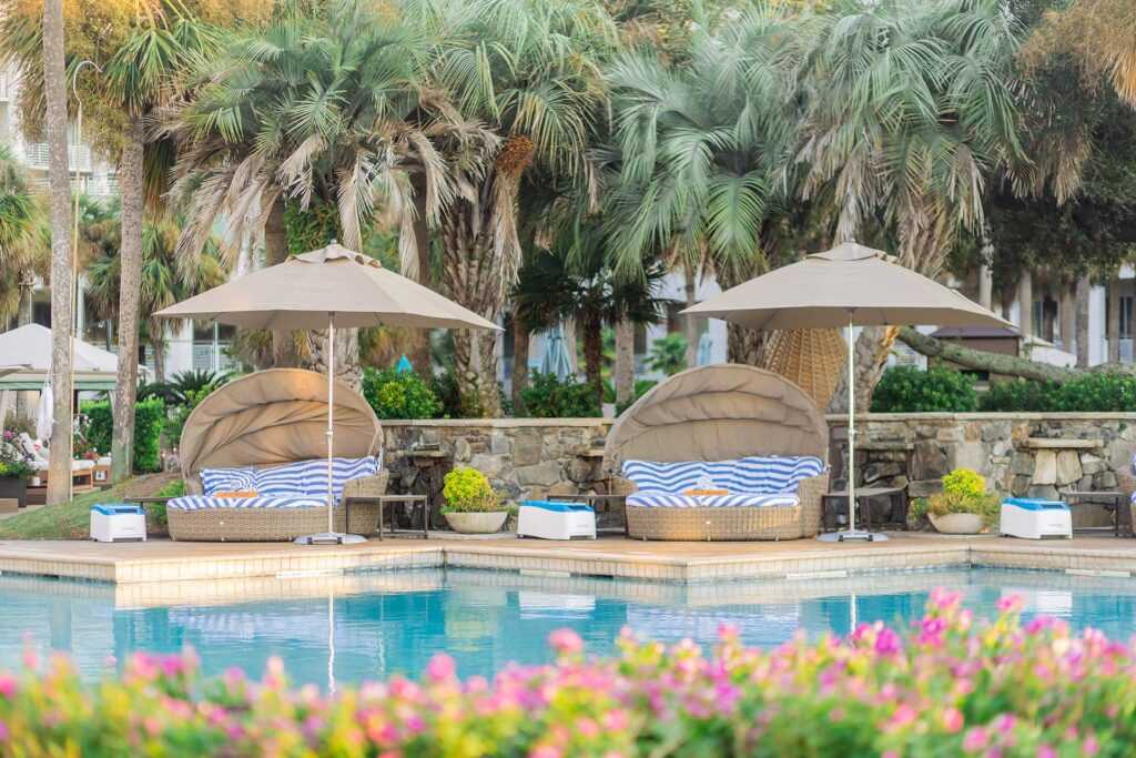 two poolside cabanas on a luxury tropical resort